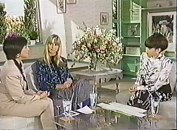 Olivia Newton-John with host and translator