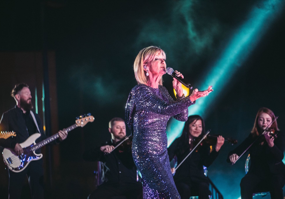 Olivia Newton-John performs at Disney's Fairy Tale Weddings 2018